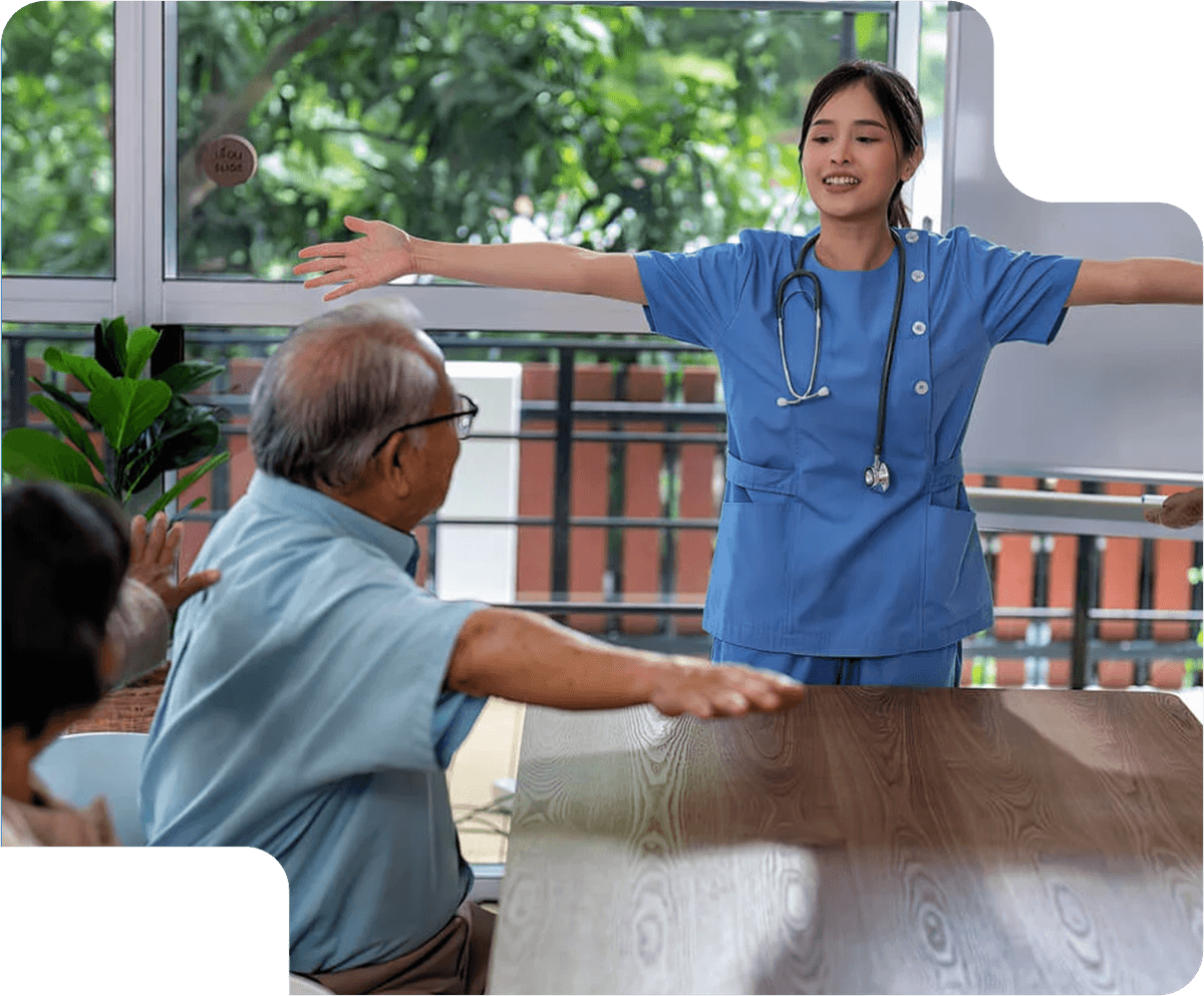 N&S Care support worker guiding a participant through an exercise session